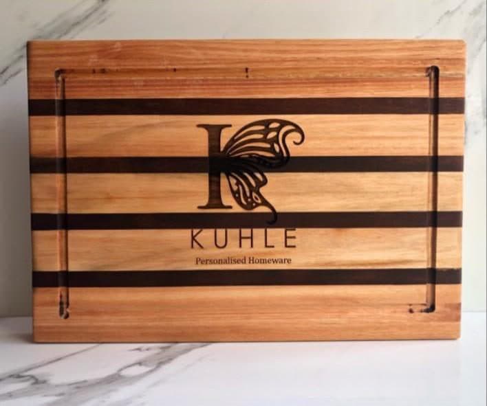 The engraved Kuhle butterfly monogram on the Nkosana Board